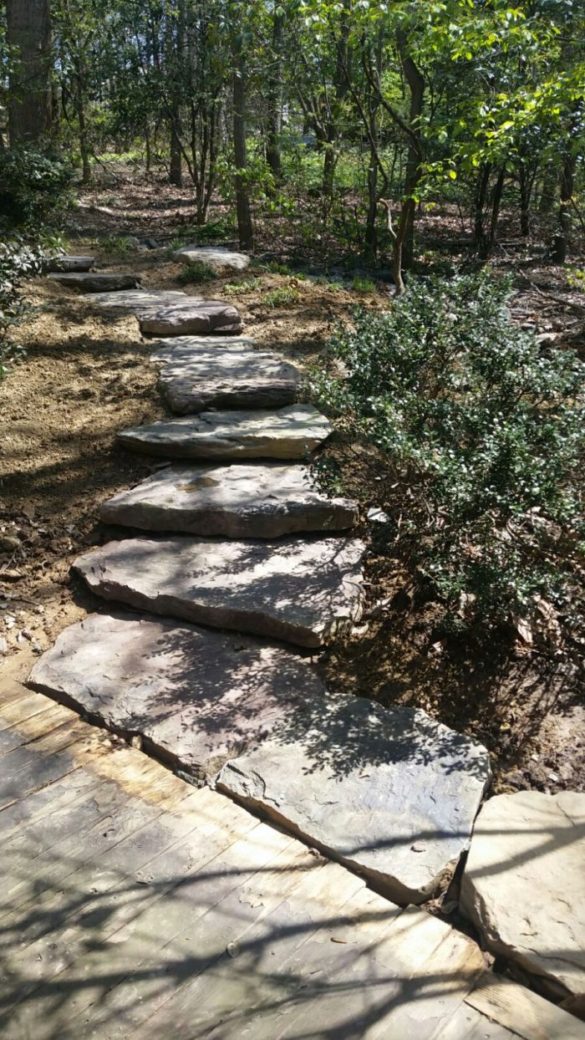 Natural large stone step path in wooded setting by Capital Masonry