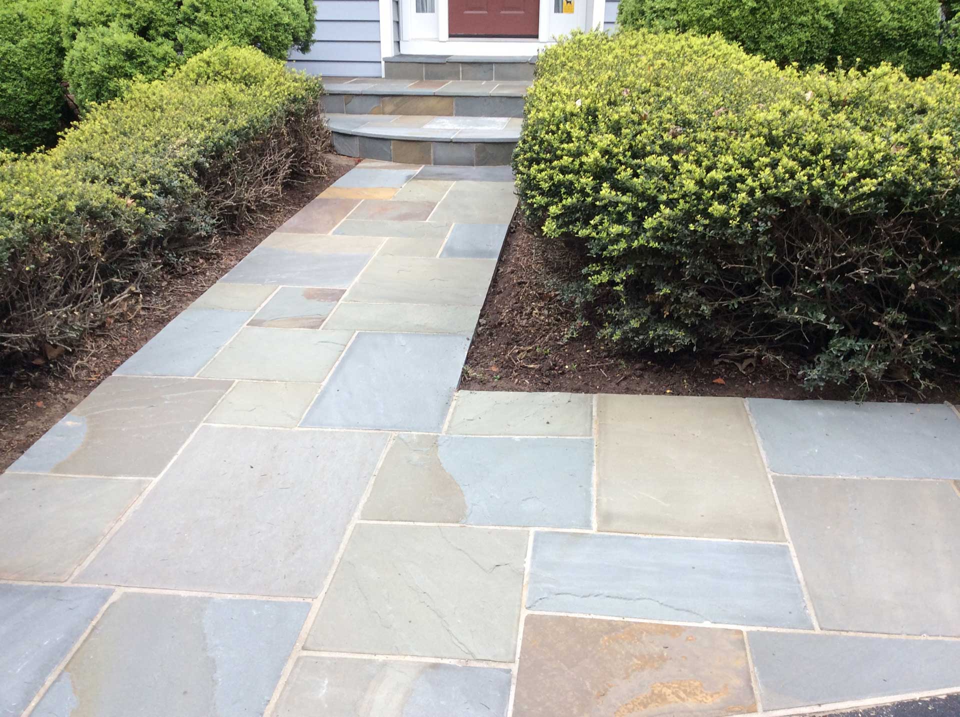 New flagstone walkway front of home by Capital Masonry