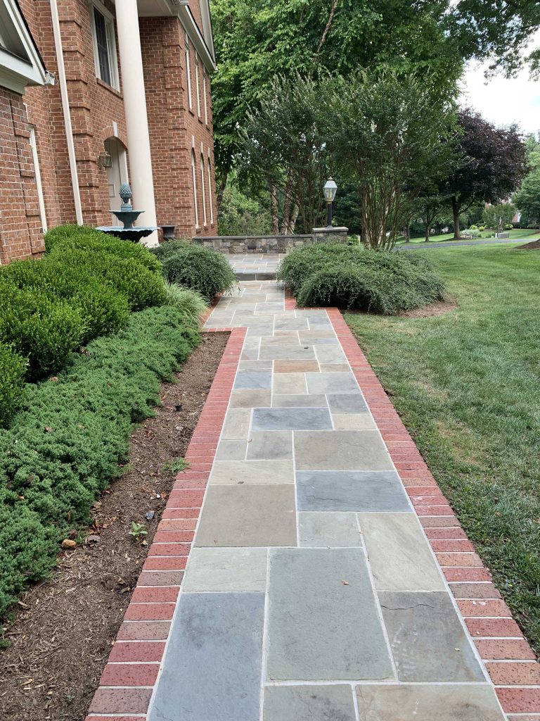 Image of Flagstone Path with Red Brick Border by Capital Masonry