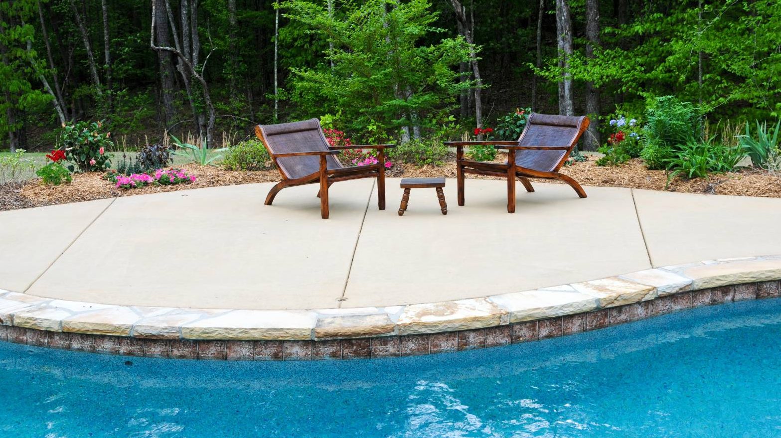 image of pool side patio of concrete