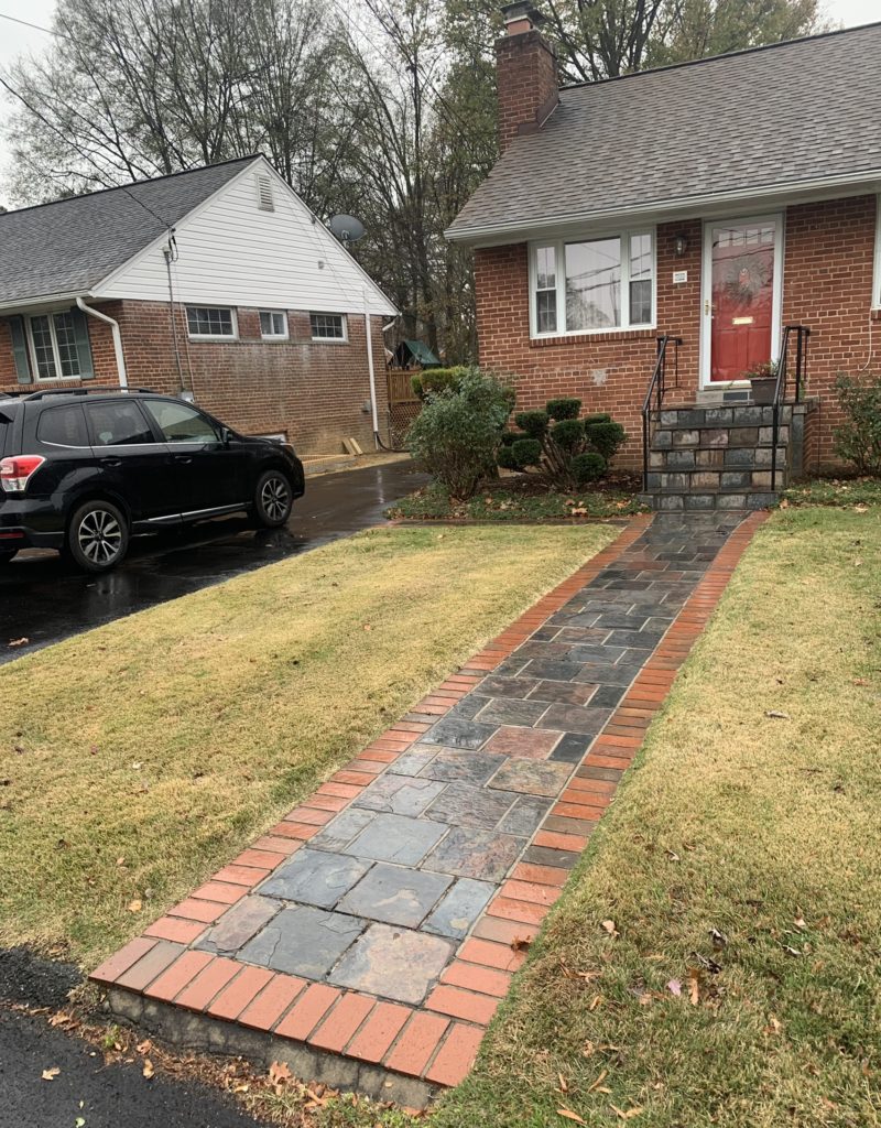 Image of flagstone front walk with red brick broder